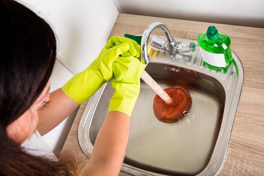 cleaning a clogged kitchen sink